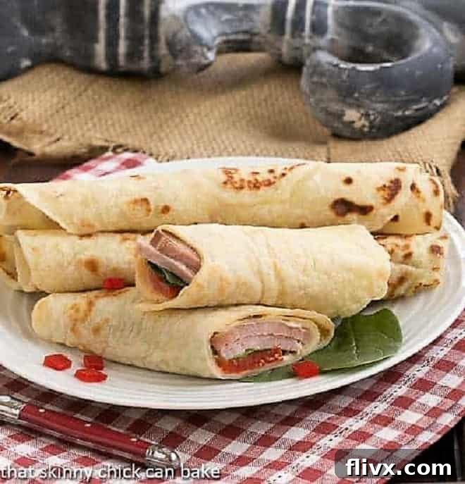 Potato Lefse sandwiches on a white serving plate, beautifully arranged for a festive occasion.