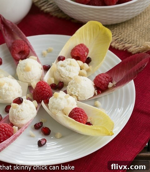 Close-up of Endive Cups with Blue Cheese, Raspberries and Macadamia Nuts, showing the intricate details.