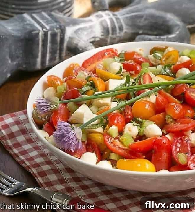 Caprese Salad with Chicken in a pristine white serving bowl, ready to be enjoyed.