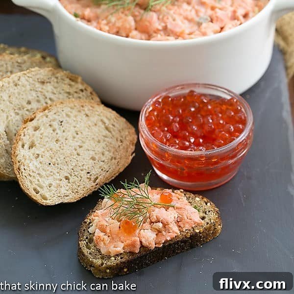Salmon Rillettes with a jar of salmon caviar, garnished with dill.