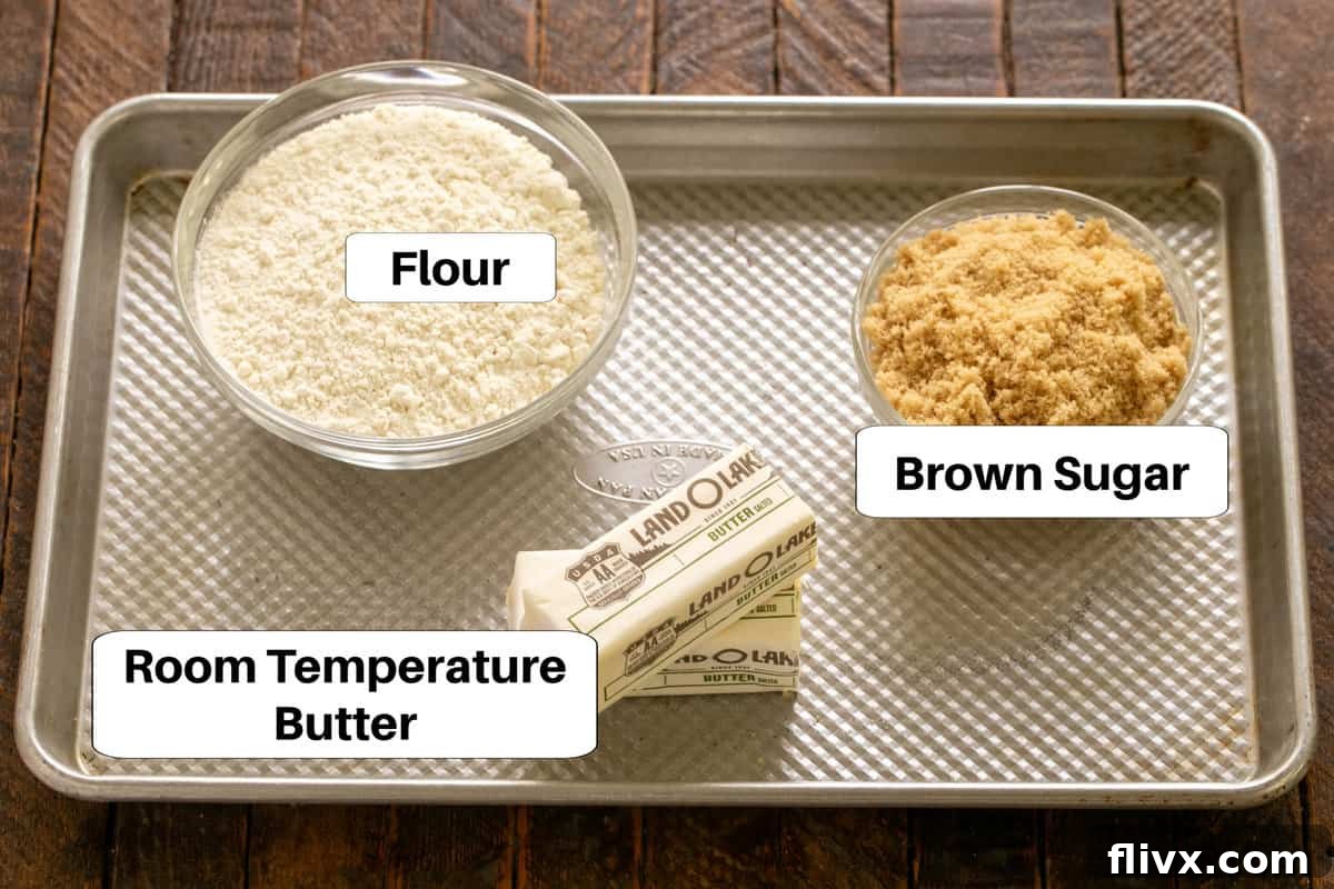 Ingredients for the truffle brownie shortbread crust laid out on a sheet pan with labels.