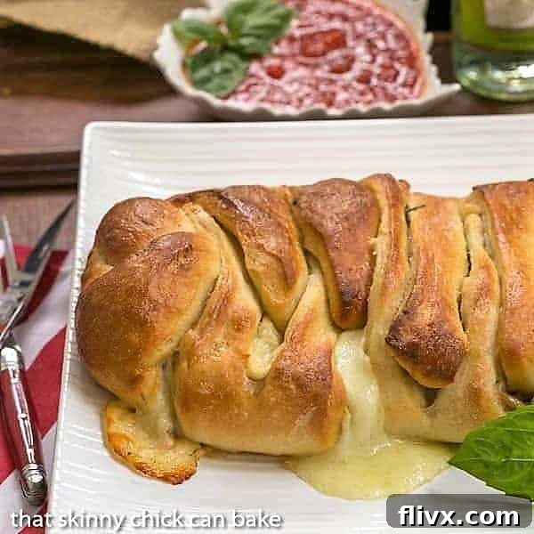Braided Stromboli on a white serving tray.