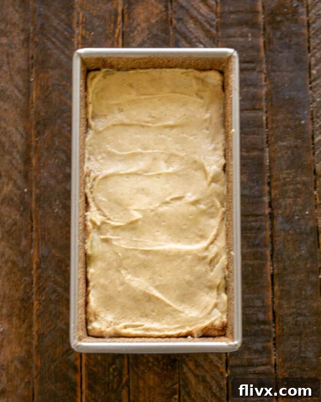 Pear bread batter in a loaf pan, ready for baking.