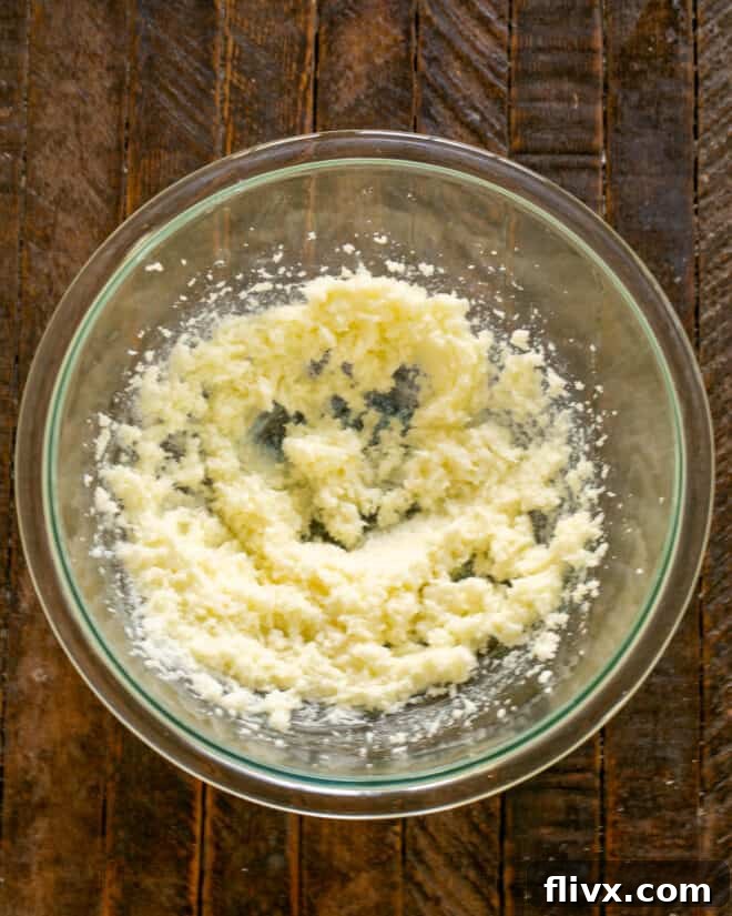 Creamed butter and sugar mixture in a bowl.