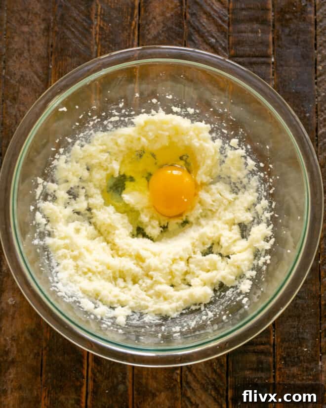 Butter and sugar mixture with an egg added.