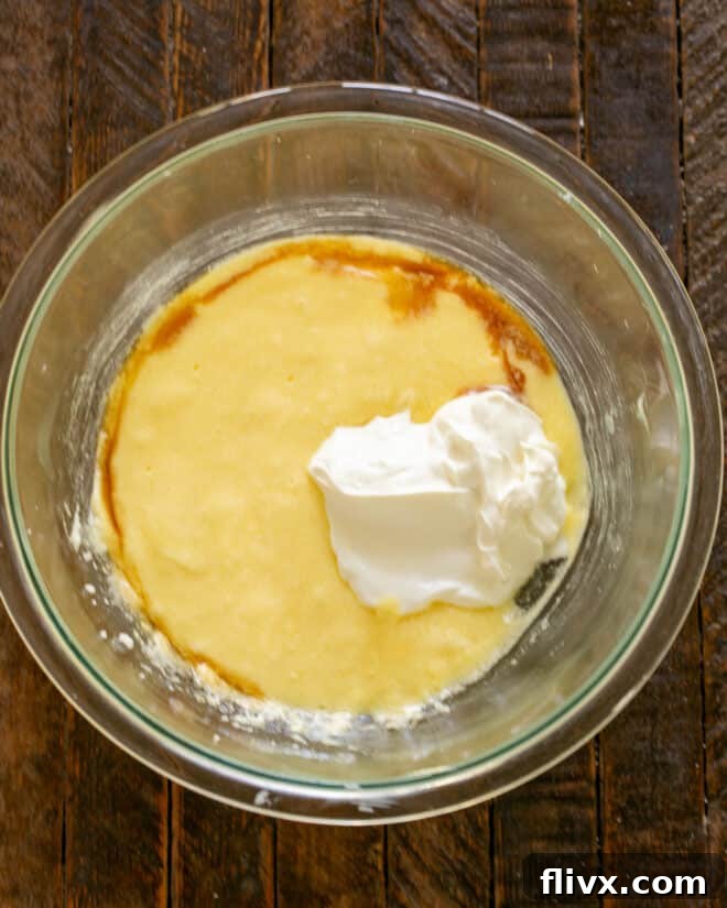 Pear batter with sour cream, vanilla, and pears mixed in.