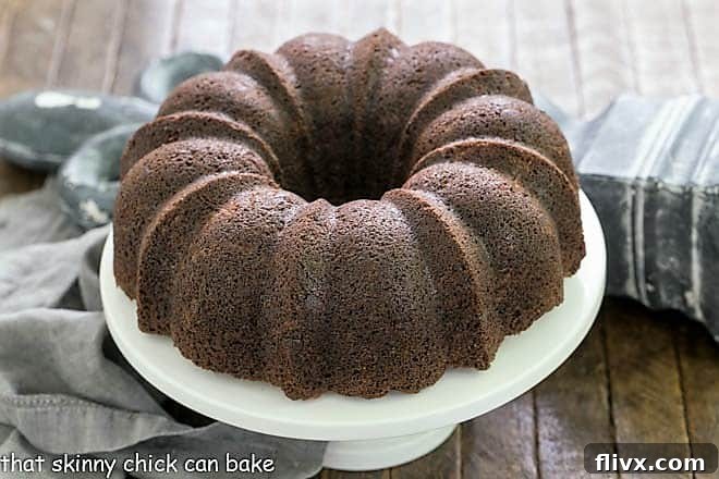 Chocolate Zucchini Bundt Cake on a white cake stand