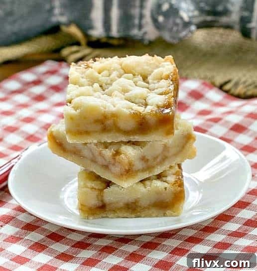 Caramel Butter Bars stacked on a small, white round plate