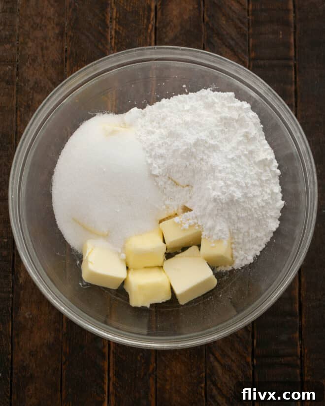Step 1: Add butter and sugars to a mixing bowl.