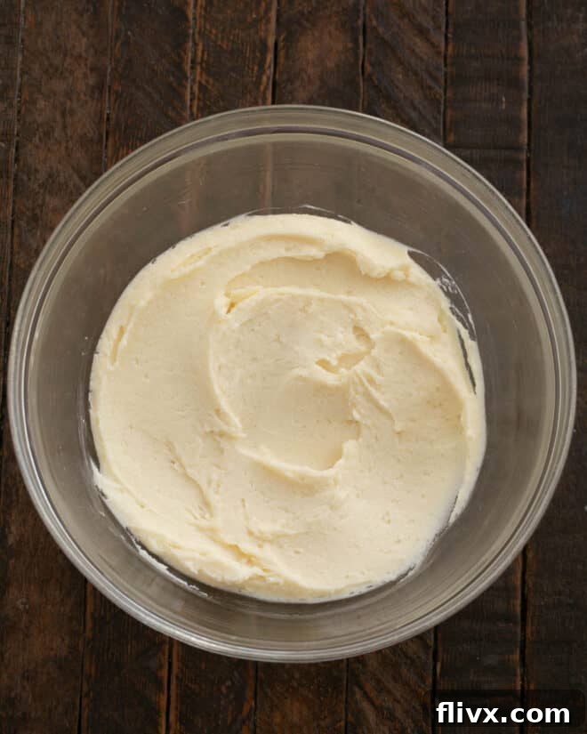 Step 2: Beat butter and sugars until creamy.