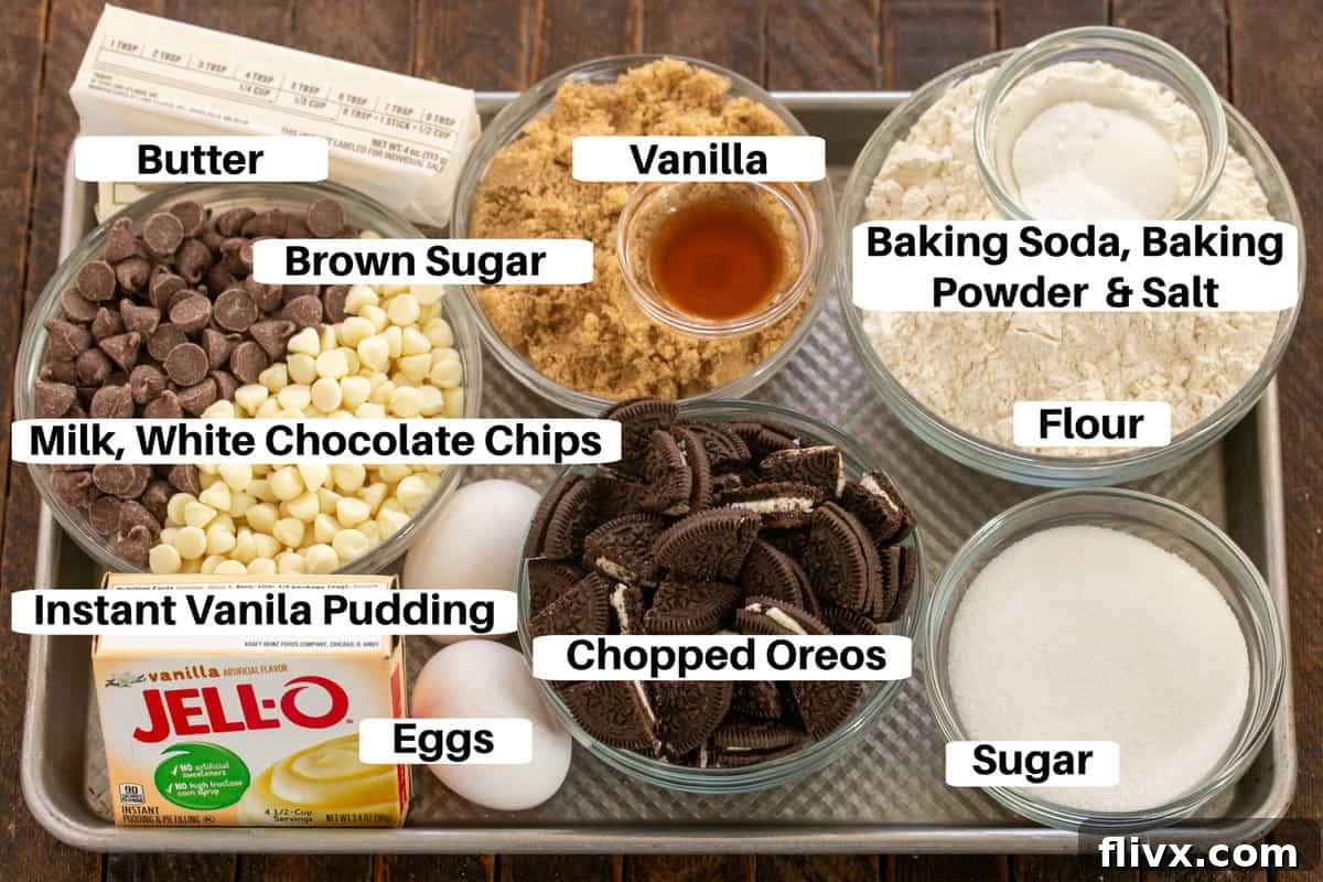 A sheet pan showcasing all the essential ingredients for baking scrumptious Oreo chocolate chip cookie bars, each item clearly labeled for convenience and easy identification.