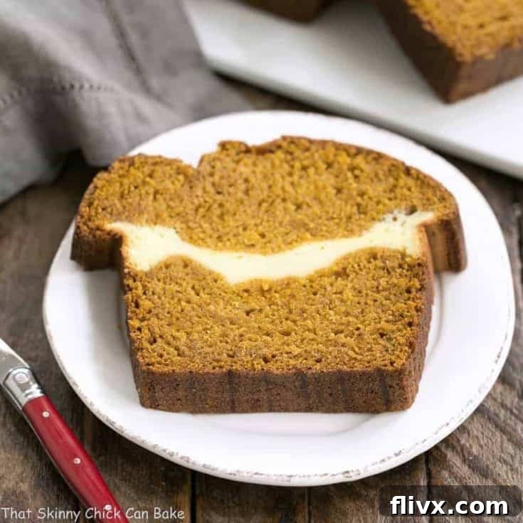Cream Cheese Filled Pumpkin Bread: A moist, delicious pumpkin loaf with a ribbon of cream cheese in the middle!