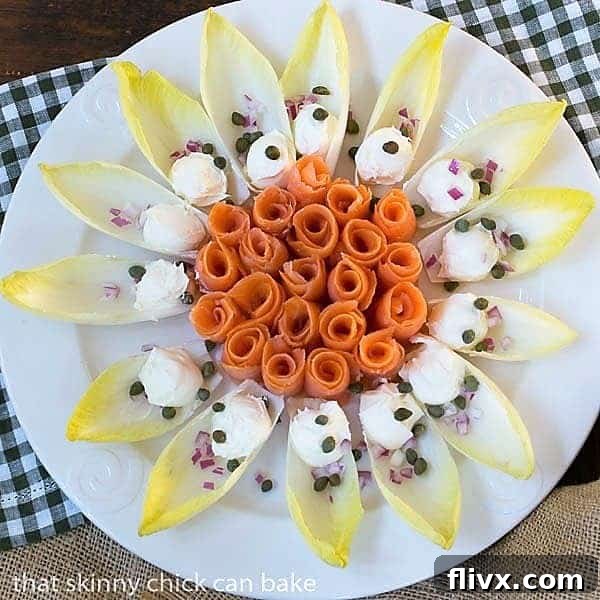 Smoked Salmon Roses with Creme Fraiche arranged elegantly on endive leaves