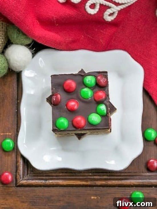 Overhead view of Candy Topped Toffee Squares on a small white plate, showcasing their delightful colors.