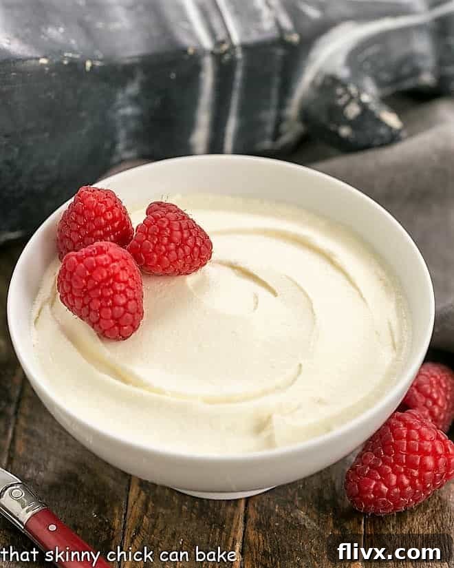 A pristine bowl of homemade mascarpone cheese, ready for use in a variety of delicious recipes.