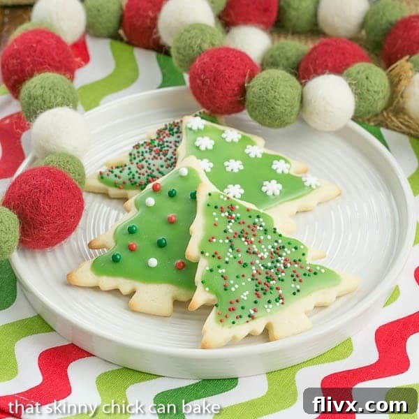 Perfectly iced cut-out sugar cookies, decorated for Christmas with festive sprinkles.