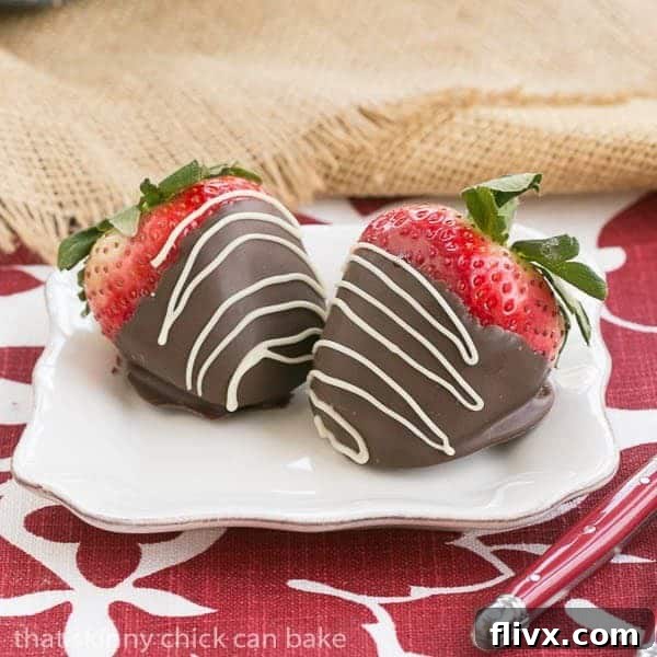 Mascarpone Filled Chocolate Covered Strawberries on a small white dessert plate