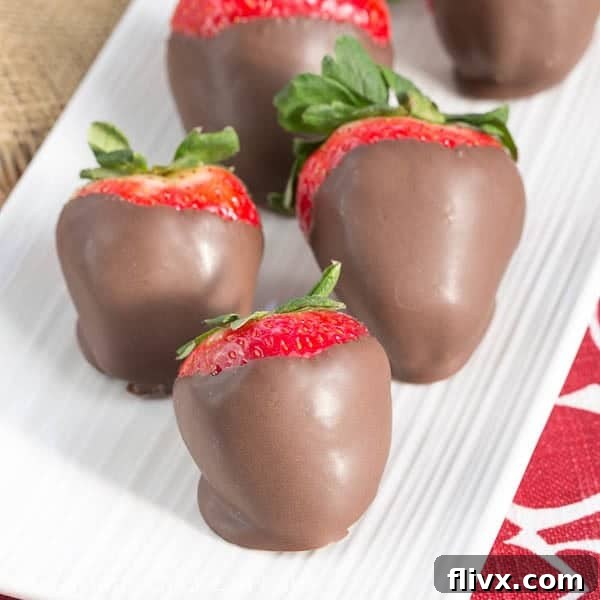 Mascarpone Filled Chocolate Dipped Strawberries on a serving tray