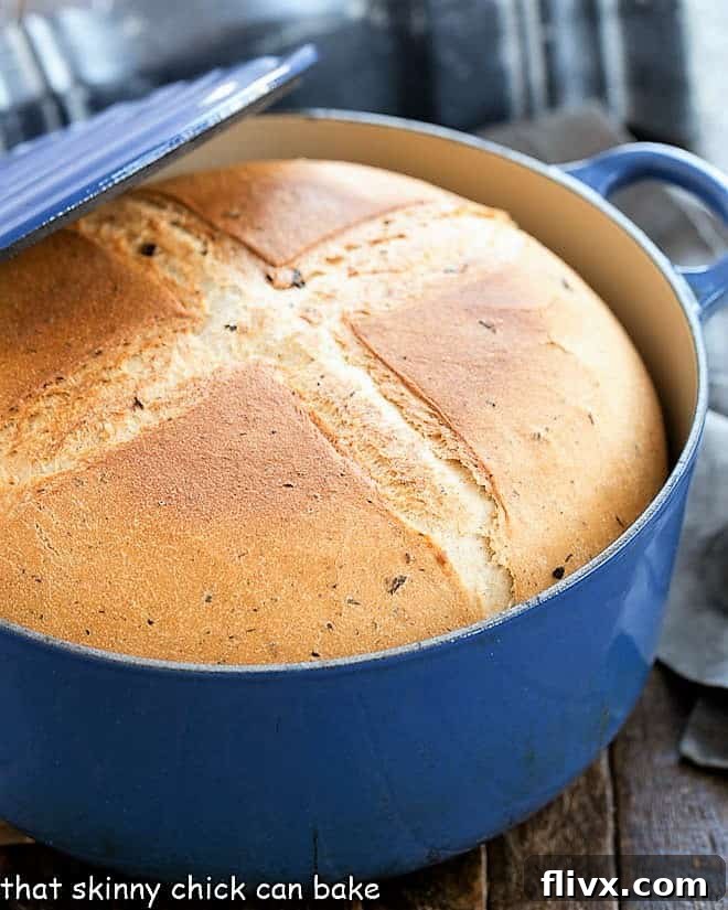 Rosemary Olive Bread in a blue Dutch oven