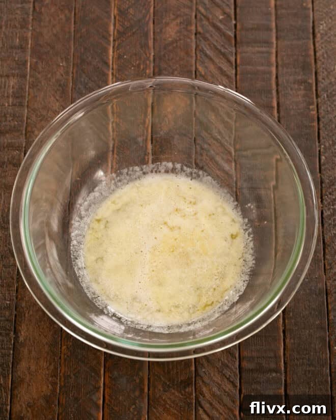 Melted butter in a microwave-safe bowl, ready for the next steps.