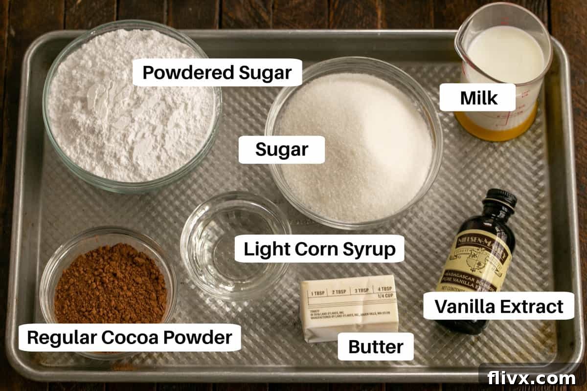 All the necessary ingredients for Cocoa Fudge Cake frosting, complete with labels, thoughtfully placed on a metal sheet pan, indicating readiness for preparation.
