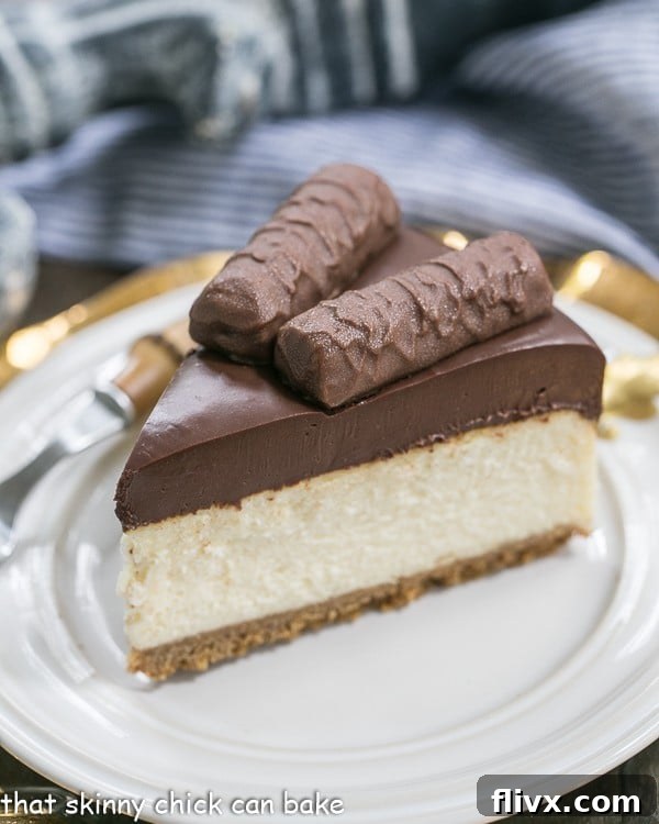 A slice of Twix Cheesecake on a white plate. A tempting slice of Twix Cheesecake, a complex dessert where precise baking and cooling are essential for its layered perfection.