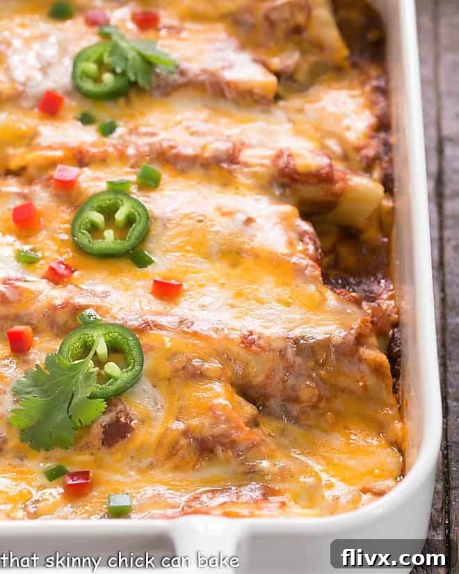 Close up of chicken manicotti in a white casserole dish