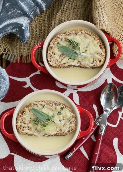 Two steaming bowls of Côte d'Azur Cure-All-Soup, garnished with green herbs, inviting immediate relief and comfort.
