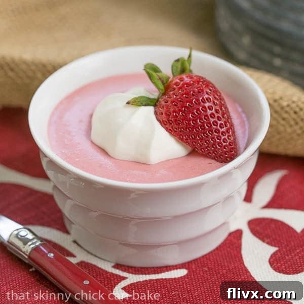 Effortless Strawberry Dream 3 Strawberry Mousse in a white ramekin on a red and white napkin.