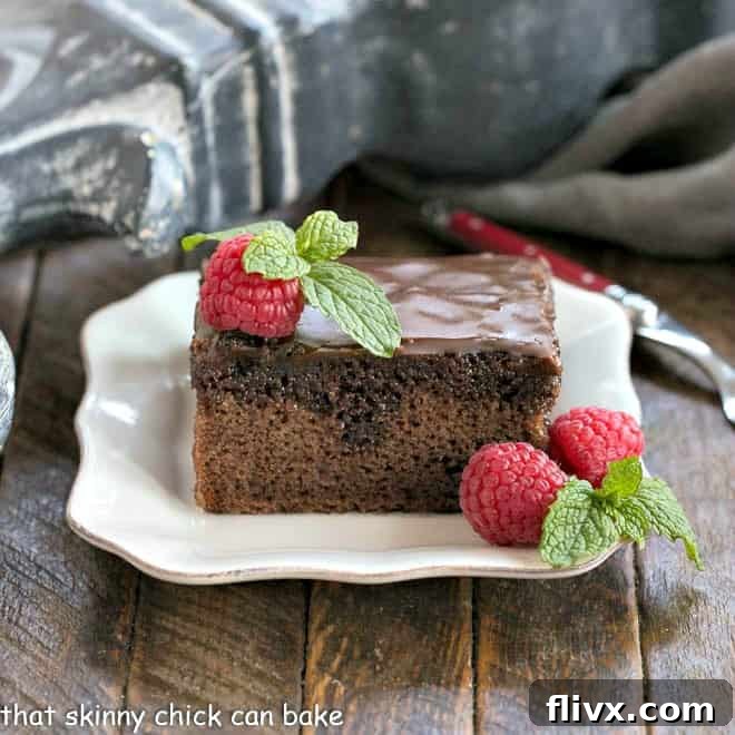 A slice of Coca Cola Cake on a square white plate.