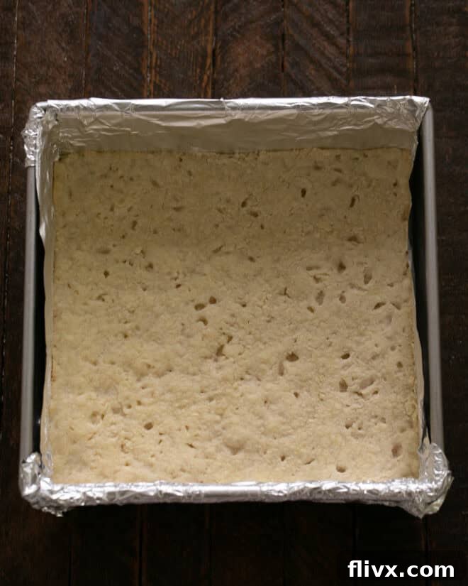 The shortbread crust baking in the oven until lightly golden.