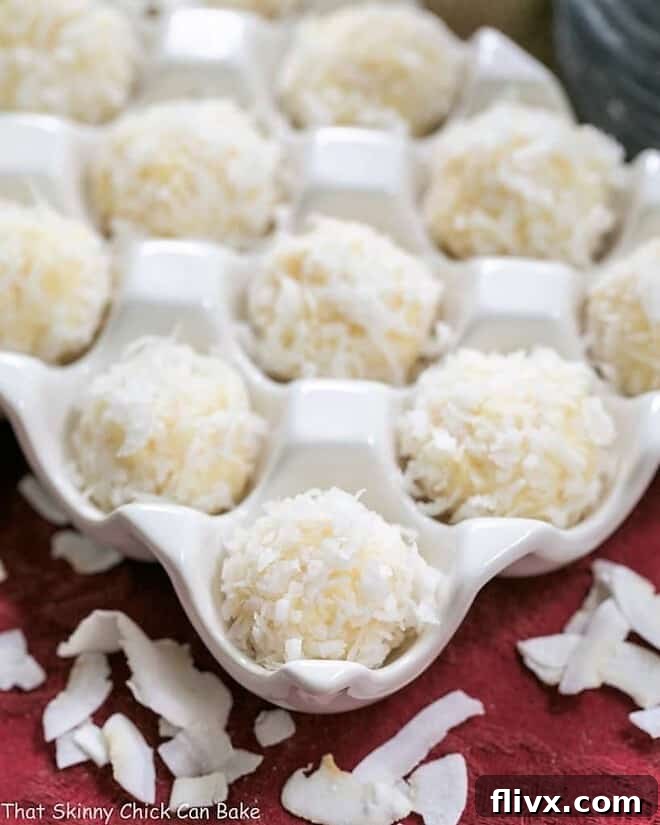 Close-up view of Coconut White Chocolate Truffles, showing the detailed texture of the coconut coating and the creamy interior.