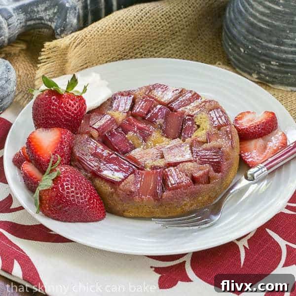 Rhubarb Upside Down Brown Sugar Cake - glistening rhubarb atop a tender cake, garnished with berries