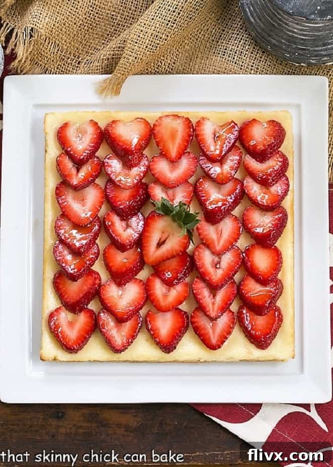 Exquisitely arranged Strawberry Cheesecake Bars on a square white platter, ready to be served.