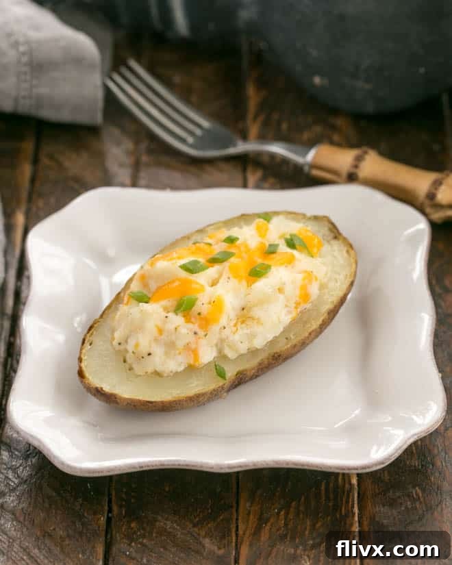 Twice baked potato on a square white plate