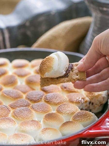 Delicious Skillet S'mores Dip, ready to be served with dippers.
