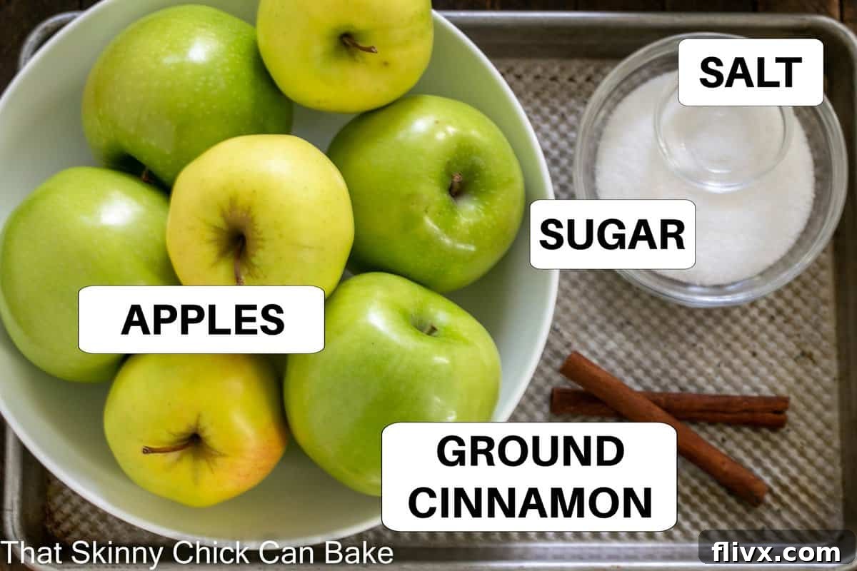 Labeled applesauce ingredients on a sheetpan, showcasing freshness and simplicity.