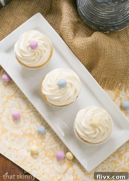 Overhead view of Buttercream Topped Vanilla Cupcakes arranged neatly.