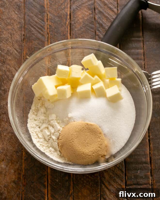 A visual guide to creating the streusel topping: showing butter being cut into a mixture of sugars and flour, resulting in a coarse, crumbly texture.