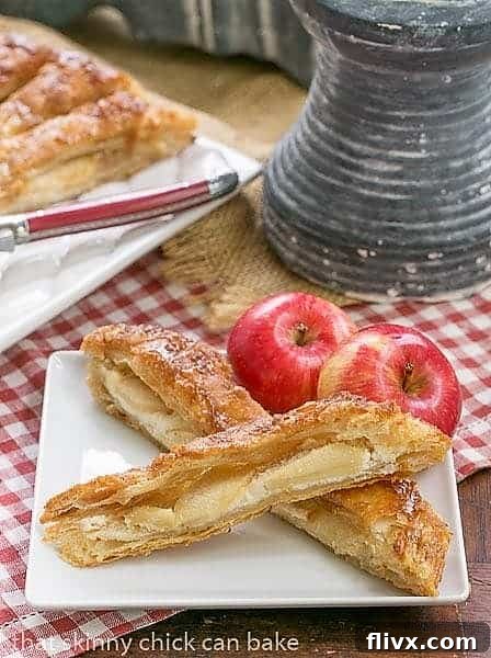 Close-up view of three individual slices of Maple Glazed Apple Tart, showcasing the golden puff pastry, tender apple filling, and glossy maple glaze on a white plate.