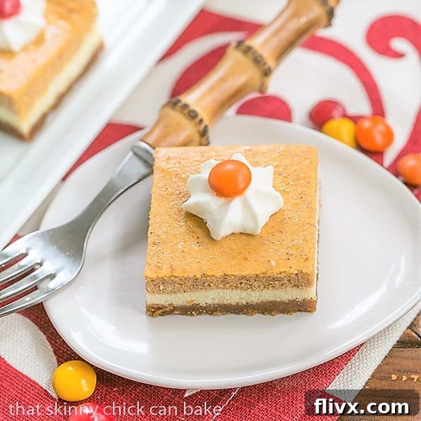 Beautifully layered Pumpkin Cheesecake Bars, perfect for fall entertaining.