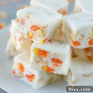 Layers of orange, yellow, and white Candy Corn Fudge