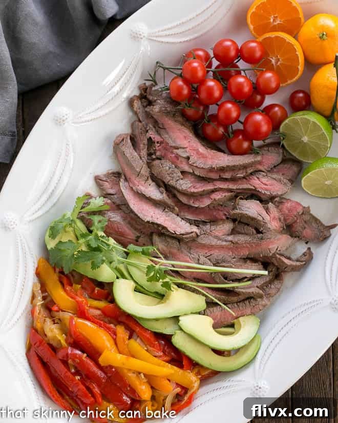 Easy Steak Fajitas Recipe and toppings from above on a white tray