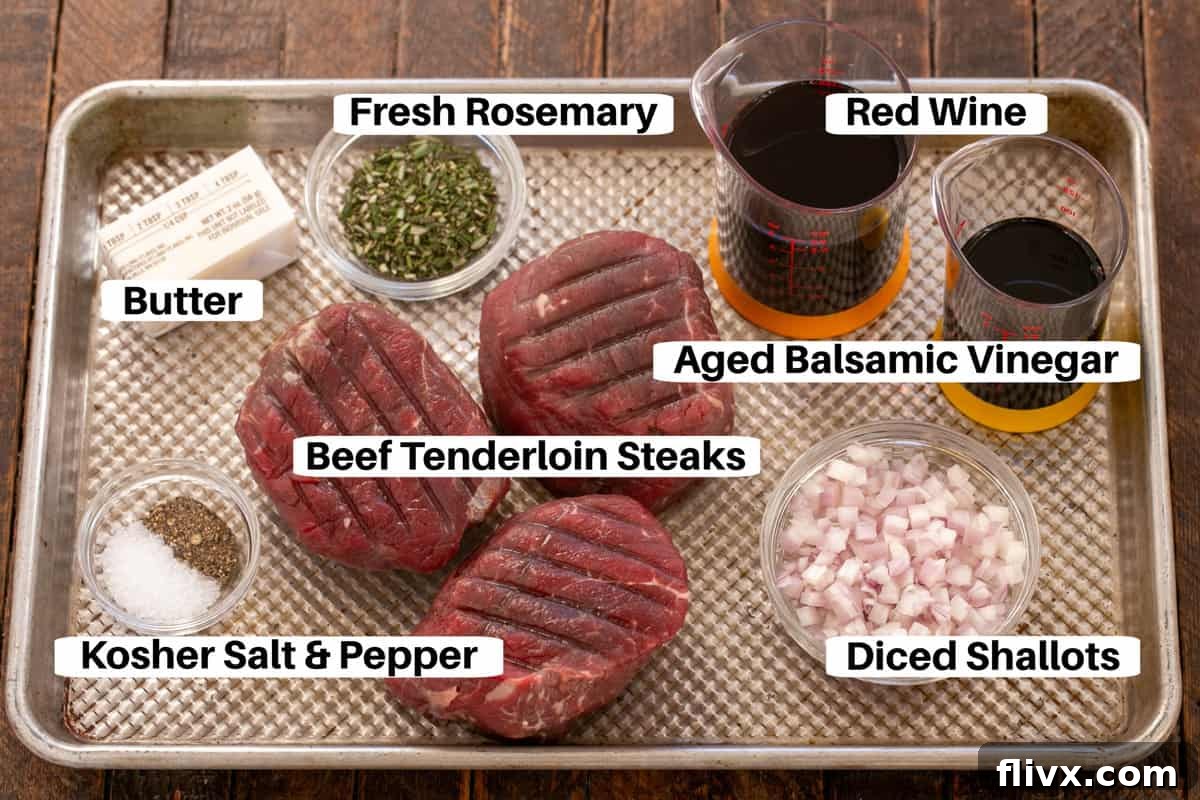 A sheet pan displaying all the key ingredients for Filet Mignon with Red Wine Balsamic Sauce, neatly organized and labeled for easy preparation.