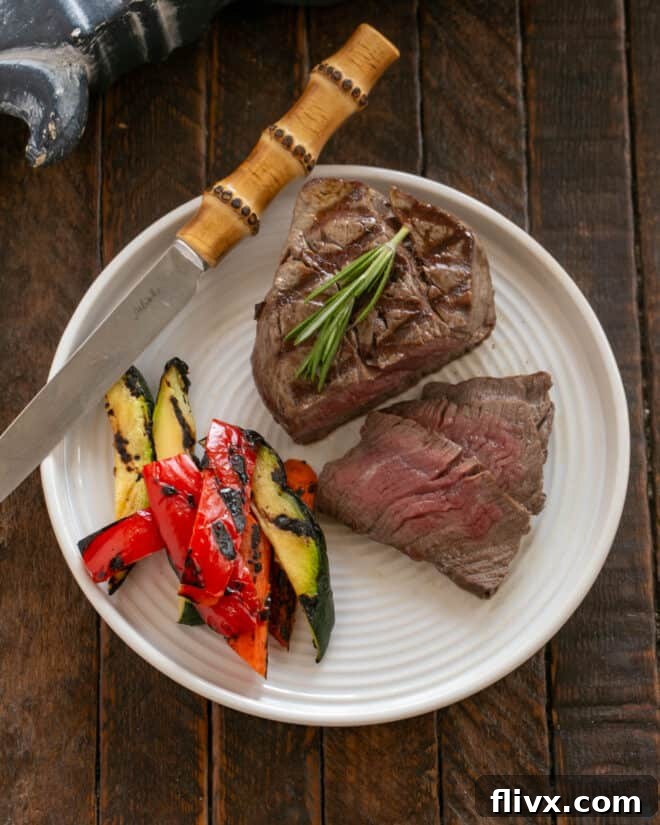 Step 4: Return the filets to the pan, coating them in the rich red wine balsamic sauce, and finish cooking to desired doneness.