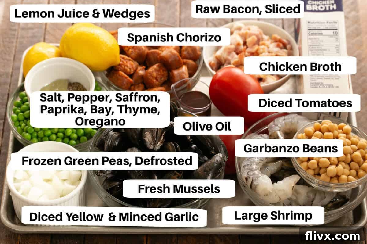 A vibrant selection of fresh ingredients for paella, including chicken, shrimp, mussels, chorizo, rice, and colorful vegetables, arranged on a baking sheet.