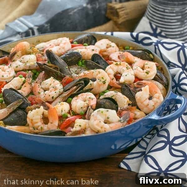 Julia Child's Paella a l'Americaine | Julia's twist on an extraordinary Spanish Classic with rice, saffron, shrimp, mussels and chorizo