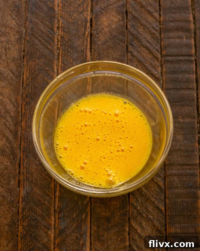 Whip egg yolks until they are light in color and fluffy.