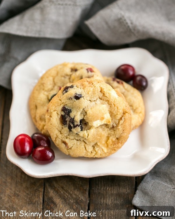 Cranberry, white chocolate, and crystallized ginger cookies, a colorful and flavorful holiday treat.