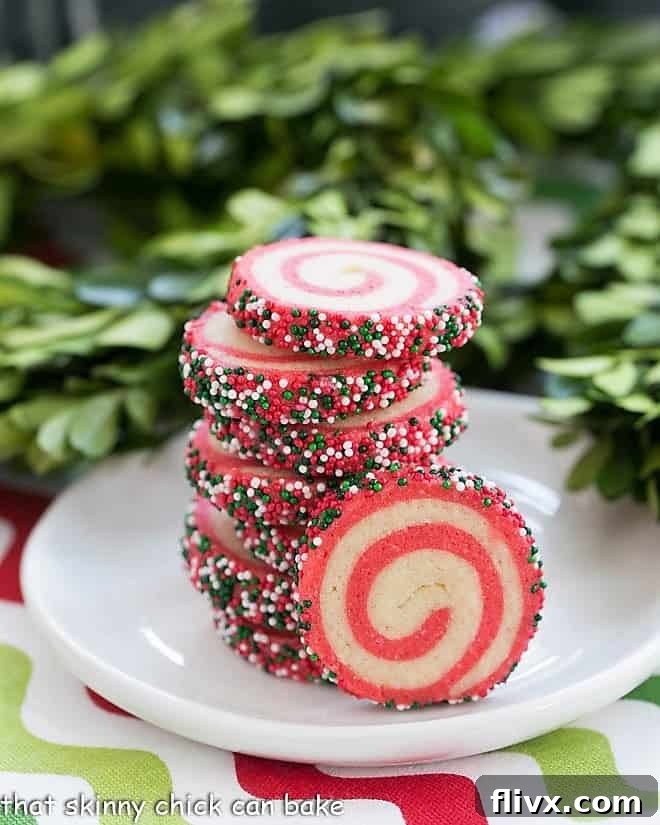 Swirled holiday pinwheel cookies with contrasting doughs, showcasing a beautiful spiral pattern.